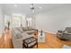 Bright living room with hardwood floors and neutral decor creating a cozy and inviting atmosphere at 1500 St Andrews Dr, Mebane, NC 27302