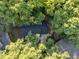 Aerial view of a cozy home nestled among mature trees at 1536 Dirkson Ct, Cary, NC 27511