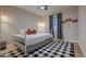 Cozy bedroom featuring a comfy bed and a bold checkered rug at 1536 Dirkson Ct, Cary, NC 27511