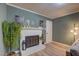 Close up of the fireplace surrounded by greenery and decor at 1536 Dirkson Ct, Cary, NC 27511
