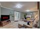 Cozy living room featuring a fireplace, comfortable seating, and stylish decor for relaxing evenings at 1536 Dirkson Ct, Cary, NC 27511