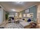 Bright living room with a fireplace, large sectional sofa, and a view into the kitchen at 1536 Dirkson Ct, Cary, NC 27511