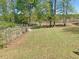 Spacious backyard featuring well-maintained grass and a partial fence at 164 Sue Dr, Angier, NC 27501
