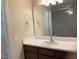 Neat bathroom with a dark vanity and a large mirror at 164 Sue Dr, Angier, NC 27501