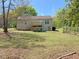 A beautiful house back exterior, including a deck and stairs to the yard at 164 Sue Dr, Angier, NC 27501