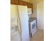 Practical kitchen layout with white appliances and wooden cabinetry at 164 Sue Dr, Angier, NC 27501