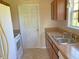 Functional kitchen featuring light countertops and wooden cabinets at 164 Sue Dr, Angier, NC 27501