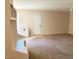 Spacious living room with neutral carpet and a built-in storage unit at 164 Sue Dr, Angier, NC 27501