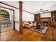 Cozy living room with a brick fireplace, built-in bookshelves, hardwood floors, and a decorative area rug at 2001 Virginia Dare Pl, Raleigh, NC 27610