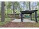 Backyard of house featuring a patio, a gazebo, and a lush green lawn at 208 Clark Lake Rd, Durham, NC 27707