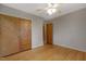Bedroom with hardwood floors, closet, and open access to other rooms at 208 Clark Lake Rd, Durham, NC 27707