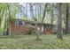 Brick home with well-maintained landscaping, a white front door and inviting curb appeal at 208 Clark Lake Rd, Durham, NC 27707