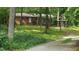 Charming single story brick home with a lovely gazebo and landscaped front yard at 208 Clark Lake Rd, Durham, NC 27707