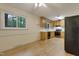 Sun-filled eat-in kitchen features modern appliances and ample cabinet space at 208 Clark Lake Rd, Durham, NC 27707