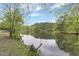 Scenic view of a calm lake surrounded by lush greenery, perfect for nature lovers at 208 Clark Lake Rd, Durham, NC 27707