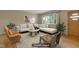 Bright, virtually staged living room with neutral decor and ample natural light at 208 Clark Lake Rd, Durham, NC 27707