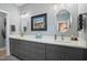 Elegant bathroom with double vanity, modern fixtures, and decorative mirrors at 21 Davidson St, Clayton, NC 27527