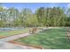 Bocce ball court surrounded by lush greenery, offering a recreational space at 21 Davidson St, Clayton, NC 27527