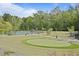 Expansive community park with lush greenery, picnic areas, and walking paths for recreation at 21 Davidson St, Clayton, NC 27527