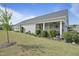 Exterior view of this home with a covered porch, manicured lawn, and tasteful landscaping at 21 Davidson St, Clayton, NC 27527