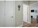 Clean hallway with white doors and neutral walls leading to other rooms, creating a welcoming and functional space at 21 Davidson St, Clayton, NC 27527
