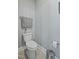 Small toilet room featuring neutral walls and flooring with chrome hardware at 21 Davidson St, Clayton, NC 27527