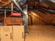 Spacious attic with ample storage, exposed wood beams, and a brand new furnace at 2113 Rockwall Farms Ln, Fuquay Varina, NC 27526