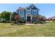 Charming two-story home featuring a welcoming front porch and beautifully landscaped front yard at 2113 Rockwall Farms Ln, Fuquay Varina, NC 27526