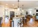Bright kitchen featuring granite countertops, stainless steel appliances and a breakfast bar at 2113 Rockwall Farms Ln, Fuquay Varina, NC 27526