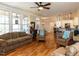Open living room showcasing hardwood floors, access to a porch and views of the kitchen at 2113 Rockwall Farms Ln, Fuquay Varina, NC 27526