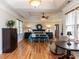 Relaxing main bedroom with dark wood furniture, a ceiling fan and windows at 2113 Rockwall Farms Ln, Fuquay Varina, NC 27526