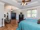 Spacious main bedroom featuring hardwood floors, tray ceiling and ensuite bathroom at 2113 Rockwall Farms Ln, Fuquay Varina, NC 27526