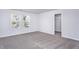 Neutral bedroom with carpet, natural light from windows and walk-in closet at 2116 Willow Gln Dr, Graham, NC 27253