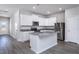 Kitchen with stainless steel appliances, granite countertops, and white cabinetry at 2116 Willow Gln Dr, Graham, NC 27253