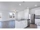 Open concept kitchen and living area with stainless steel appliances and granite countertops at 2126 Willow Gln Dr, Graham, NC 27253