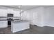 Modern kitchen with white cabinets, granite countertops, and stainless steel appliances at 2126 Willow Gln Dr, Graham, NC 27253