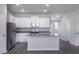 Modern kitchen featuring stainless steel appliances, granite countertops, and white cabinetry at 2126 Willow Gln Dr, Graham, NC 27253