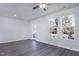 Open living room with ample natural light, neutral paint, LVP flooring, and a modern ceiling fan at 2126 Willow Gln Dr, Graham, NC 27253