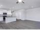 Bright open-concept living room and kitchen with gray wood floors and modern appliances at 2126 Willow Gln Dr, Graham, NC 27253