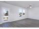 Bright and spacious living room with luxury vinyl flooring, plenty of natural light, and neutral paint at 2126 Willow Gln Dr, Graham, NC 27253