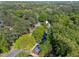 Homes nestled within a mature green forest at 216 Burkwood Ln, Raleigh, NC 27609