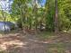 A wooded lot slopes gently away from the home, offering the peace of nature at 216 Burkwood Ln, Raleigh, NC 27609