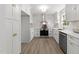 Modern kitchen featuring white cabinetry, stainless steel appliances, and stylish backsplash at 216 Burkwood Ln, Raleigh, NC 27609