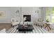 Cozy living room showcasing a fireplace, plush seating, and stylish decor at 216 Burkwood Ln, Raleigh, NC 27609