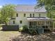 Back of home with screened in porch in a private wooded backyard at 216 Dairyland Rd, Chapel Hill, NC 27516
