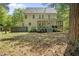Large yard with a spacious back exterior, and screened porch at 216 Dairyland Rd, Chapel Hill, NC 27516