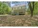 The backyard has a large yard with mature tree coverage at 216 Dairyland Rd, Chapel Hill, NC 27516