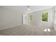 Spacious, well-lit bedroom with neutral carpet and paint and a view to nature at 216 Dairyland Rd, Chapel Hill, NC 27516