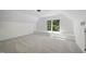 Bonus room featuring neutral carpet, paint and a large window with tree views at 216 Dairyland Rd, Chapel Hill, NC 27516