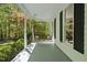 Inviting front porch featuring a swing and views of the lush surrounding greenery at 216 Dairyland Rd, Chapel Hill, NC 27516